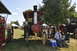 1959 Kenworth W900A - Steam tractors on display at an outdoor event, with attendees observing.