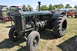 1959 Kenworth W900A - A vintage Rumely tractor is displayed outdoors at an event with other antique farm equipment.
