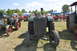 1959 Kenworth W900A - Several vintage tractors are displayed outdoors on a sunny day at an event.