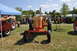1959 Kenworth W900A - Several vintage tractors are displayed outdoors on a sunny day at an event.