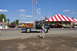 1959 Kenworth W900A - A vintage fire truck with a tall ladder is seen at an outdoor event with a large tent.
