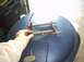 1991 Ford Crown Victoria - Close-up of disassembled pedal assembly parts and a brake pedal, likely for a vehicle.