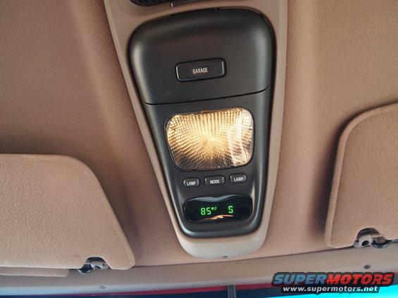 Overhead console with garage door opener button, interior light, and 85F S display. 1994 Ford Bronco interior