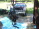 1966 Ford Ranchero - The engine is being removed from a 1966 Ford Ranchero using a hoist and chain assembly.