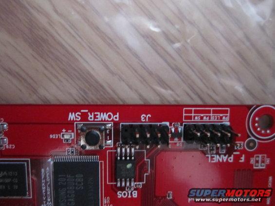 Red circuit board with 'POWER SW' and 'F PANEL' labels, and connectors
