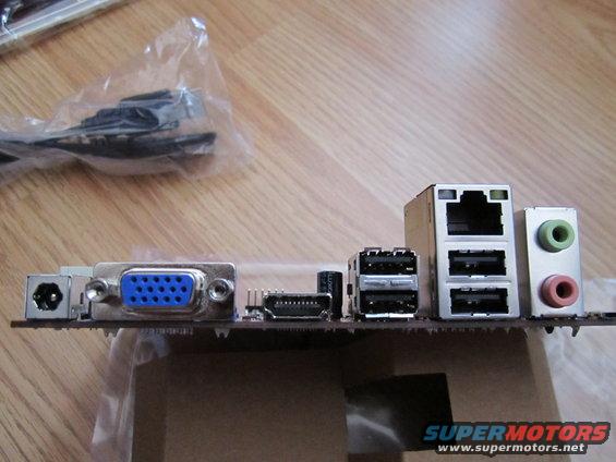 Computer motherboard rear ports including VGA, USB, Ethernet, and audio jacks
