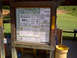 1982 Ford Bronco - Information board details fees and rules for the Panther Top Shooting Range in Nantahala National Forest.