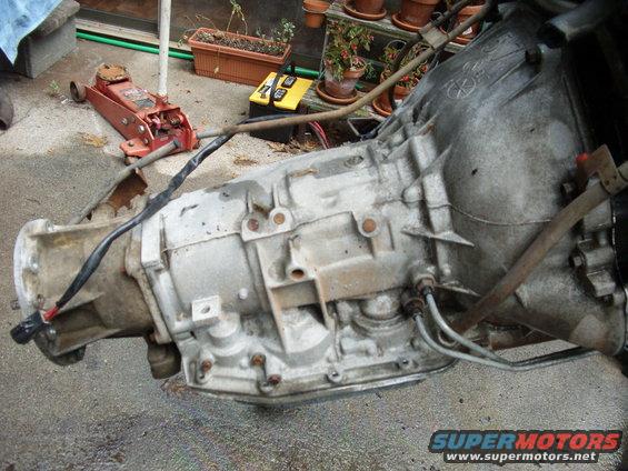 picture-003.jpg Well this is an AOD trans, because it has a mechanical shift down cable bracket. These were highly used up until the AODE, which went electrical for smoother shifting & had a better gearing range.