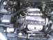 2003 Ford Crown Victoria - Close-up view of a car's engine bay, showing various mechanical parts and wiring.