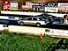 2003 Ford Crown Victoria - A silver sedan, likely a 2003 Ford Crown Victoria, races down the drag strip with another vehicle visible.