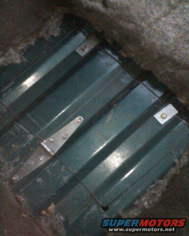 apr18_0003.jpg the door installed befor adding an extra pair of hindges and another tab. covers the hole pervectly and the carpet makes the bumps fro mthe hinge and screws unnoticable.