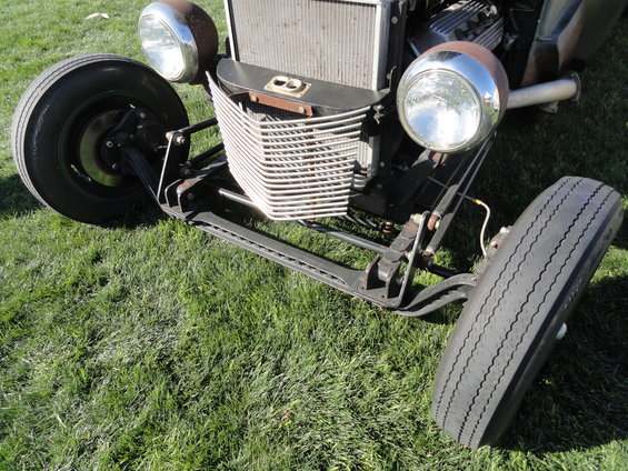 Hot rod front end with chrome headlights, custom grille, and exposed engine components