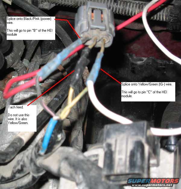 Close-up of engine wiring with instructions for splicing wires to an HEI module