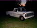1967 Ford F-250 - White 1967 Ford F-250 pickup truck sits in a grassy field as the sun sets.