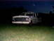 1967 Ford F-250 - A white Ford F-Series truck sits in a grassy field under a dark night sky.