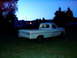 1967 Ford F-250 - A white 1967 Ford F-250 pickup truck sits in a grassy area under a twilight sky.
