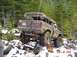 1989 Ford Bronco - This 1989 Ford Bronco navigates a challenging off-road course with snow and rocks.