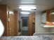 1967 Ford Mustang - This is the interior of a recreational vehicle, wood cabinetry and a microwave oven.