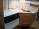 1967 Ford Mustang - Interior view of an RV kitchen area a sink, faucet, and stove.