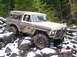 1989 Ford Bronco - This modified Ford Bronco is shown off-roading in a rocky, snowy environment. The date "NOV 8 2003" is visible.