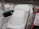 1995 Ford Probe - Two cars are parked side-by-side, both covered in snow, with one car's door ajar.