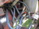 1988 Ford Bronco - Close-up view of hydraulic hoses and fittings on a red tractor.