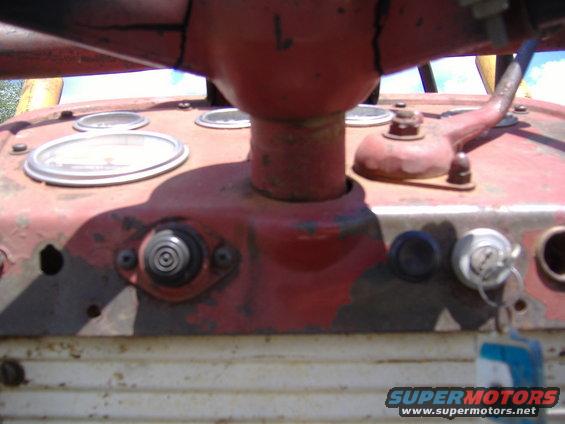 Red tractor dashboard with gauges and ignition key