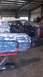 1973 Chevrolet Camaro - This 1973 Chevrolet Camaro is undergoing bodywork in a shop, showing primer and exposed metal.
