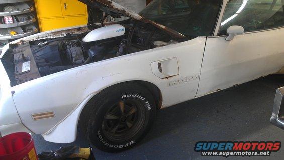 White 1973 Pontiac Trans Am with hood open, showing 455 engine