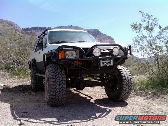 1985 Toyota 4Runner, front view, white and black with winch and brush guard