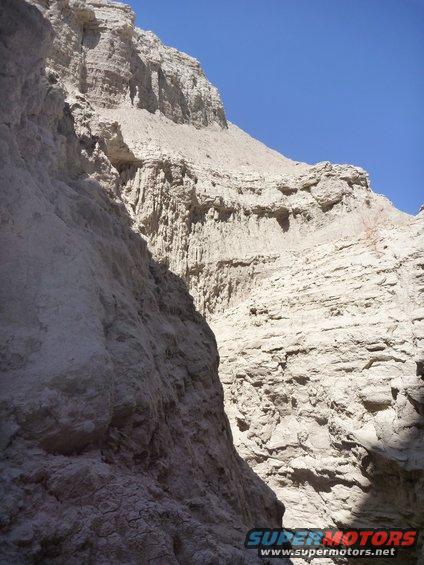rock canyon walls under a clear blue sky