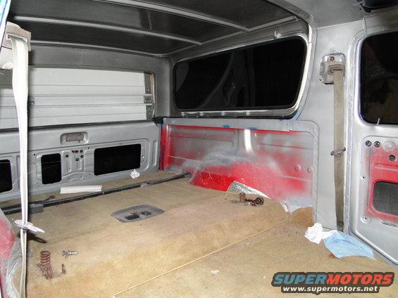 1978 Ford Bronco interior showing carpet, red painted rear panels, and window frames