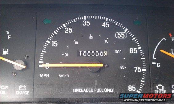 Speedometer shows 0 mph, odometer reads 100000 miles. Fuel and temperature gauges are visible