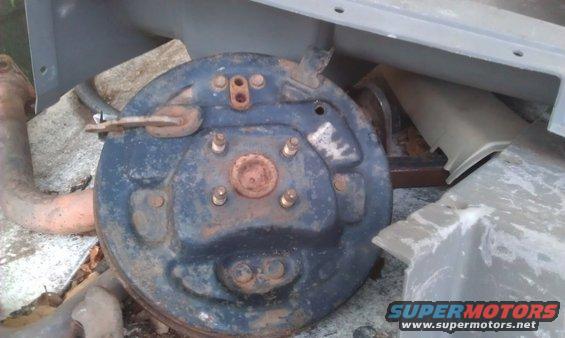 Rusty brake drum assembly with exhaust pipe fragment