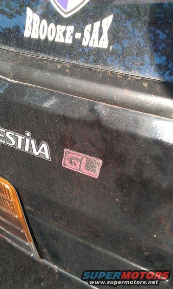 Rear of a Ford Festiva with a GL badge and a BROOKE-SAX sticker