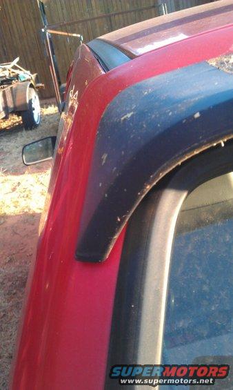 Red car side panel and black fender flare