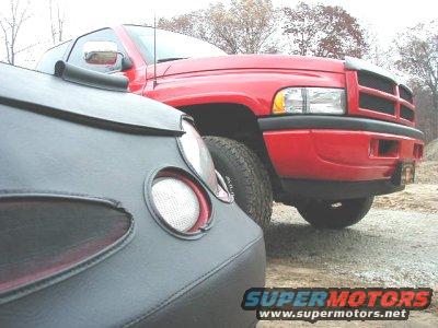 Red pickup truck front grille and headlight