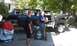 1979 Ford Bronco - Two men are working on a disassembled SUV, possibly a Ford Bronco, with a welding torch and gas tanks.