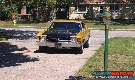Yellow and black 1973 coupe with a black hood scoop