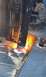 1979 Ford Bronco - Metal fabrication in progress with a cutting torch, sparks illuminate the work area.