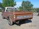 1979 Ford F-150 - This Ford pickup truck features a wooden bed extension and a visible "FORD" tailgate emblem. The year is likely 1977.