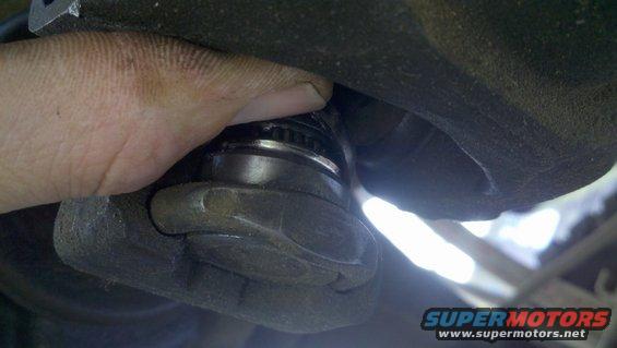 hand holding ball joint during replacement