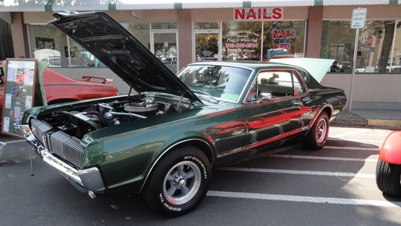 Green 1967 Mercury Cougar with hood and trunk open