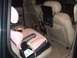 1996 Ford Bronco - Interior view of a vehicle equipped with child safety seats and a rear-seat entertainment system.