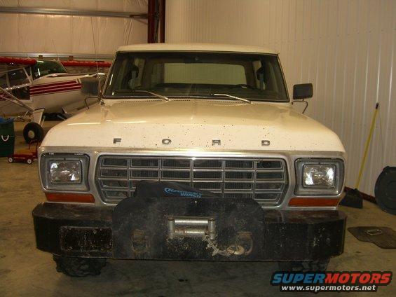 White 1979 Ford Bronco front view with a winch mounted on the bumper