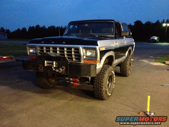 Black and silver 1979 Ford Bronco with winch and aftermarket bumper