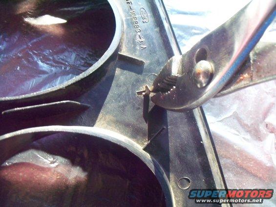 trim-paint-006.jpg If applicatable, you can remove the padded panel from the gauge cluster surround panel by using a pair of pliers and straightening the clips that protrude through the back of the gauge cluster surround, it only takes a quarter turn.