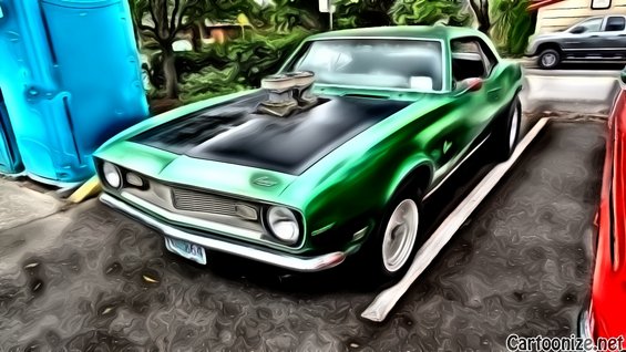 Green 1969 Chevrolet Camaro with a large hood scoop and black hood
