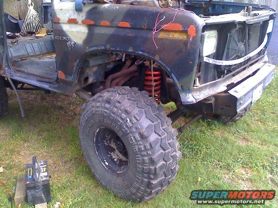 Ford Bronco body, camouflaged paint, large off-road tires, exposed engine components. 1978 model year