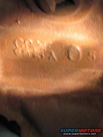 Close-up of stamped numbers on a metal part, possibly a VIN or casting number